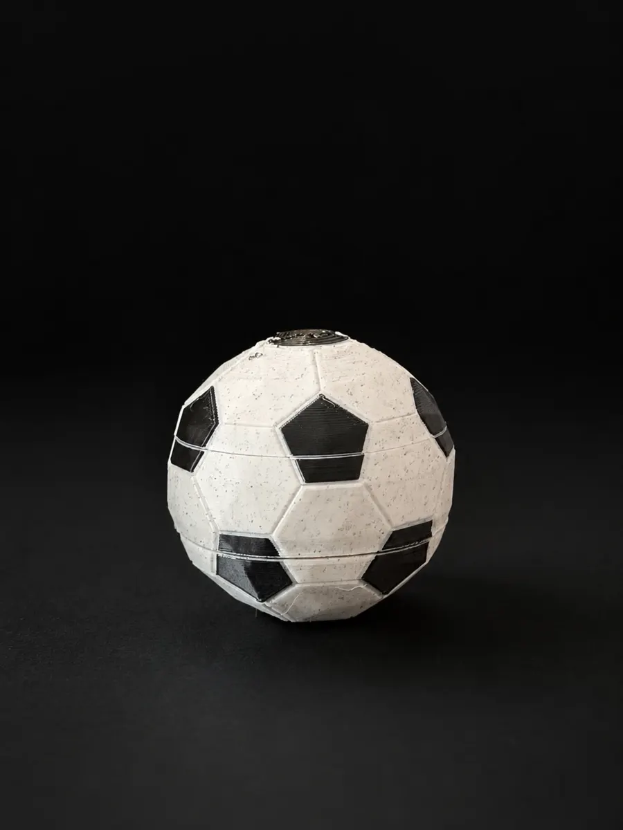 Balle anti-stress ballon de foot imprimée, avec un cœur qui tourne